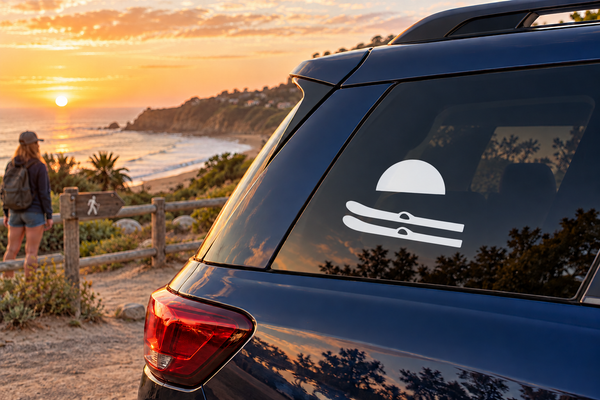 Water skiing vinyl decal with sun and skier icon on car window
