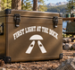 Water Skiing vinyl decal with text “FIRST LIGHT AT THE DOCK” and a tent-like icon