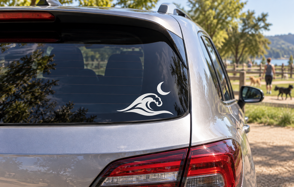 Black crescent moon and wave vinyl decal on car rear window