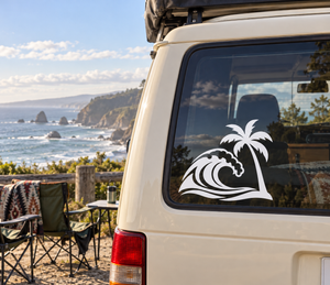 Vinyl decal of black palm tree and wave on a car window