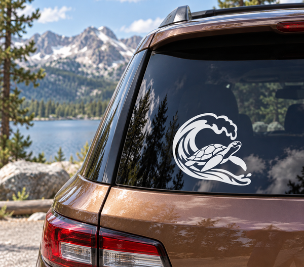 Sea turtle vinyl decal on car window, white and dark wave outline
