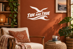 Tide And True wave vinyl decal with bird silhouette and logo on wall