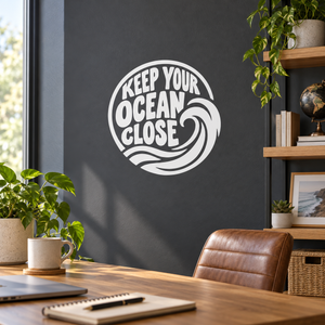 Circular vinyl decal with 'KEEP YOUR OCEAN CLOSE' text and wave graphic