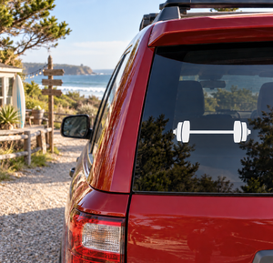 Vinyl barbell decal on car window with white bar and weight plates