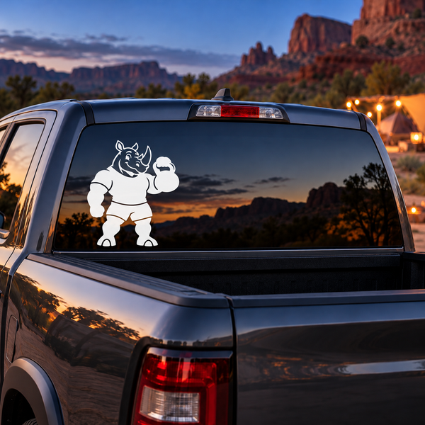 Vinyl weightlifting rhino decal on truck rear window, holding a dumbbell