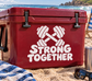 Red vinyl decal with white dumbbells and “Strong Together” text on cooler