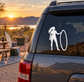 White windsurfing vinyl decal: woman silhouette holding circular loop on car window.
