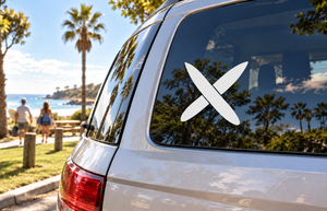 White surfboard cross vinyl decal pair with X-shaped boards