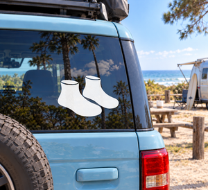 Vinyl water boot decal pair with two white boot silhouettes on a window.