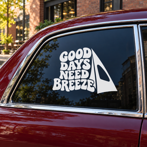 Vinyl windsurfing decal: 'Good Days Need Breeze' with white sail on car window
