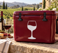 White wine glass vinyl decal on glossy maroon cooler, front view