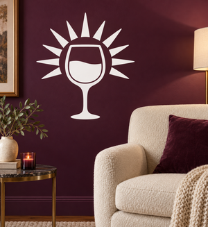 Wine glass vinyl decal with sunburst rays, white outline on dark wall