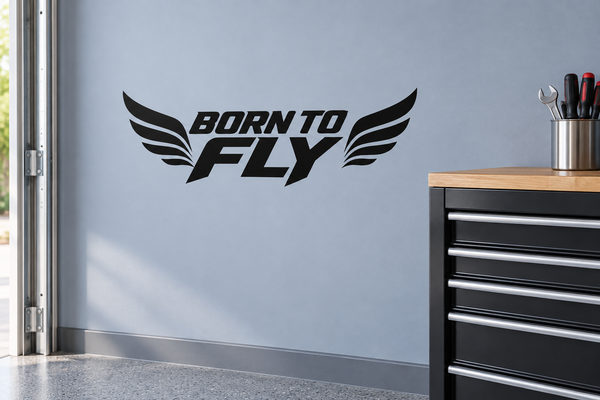 Black "BORN TO FLY" wing vinyl wall decal with stylized lettering