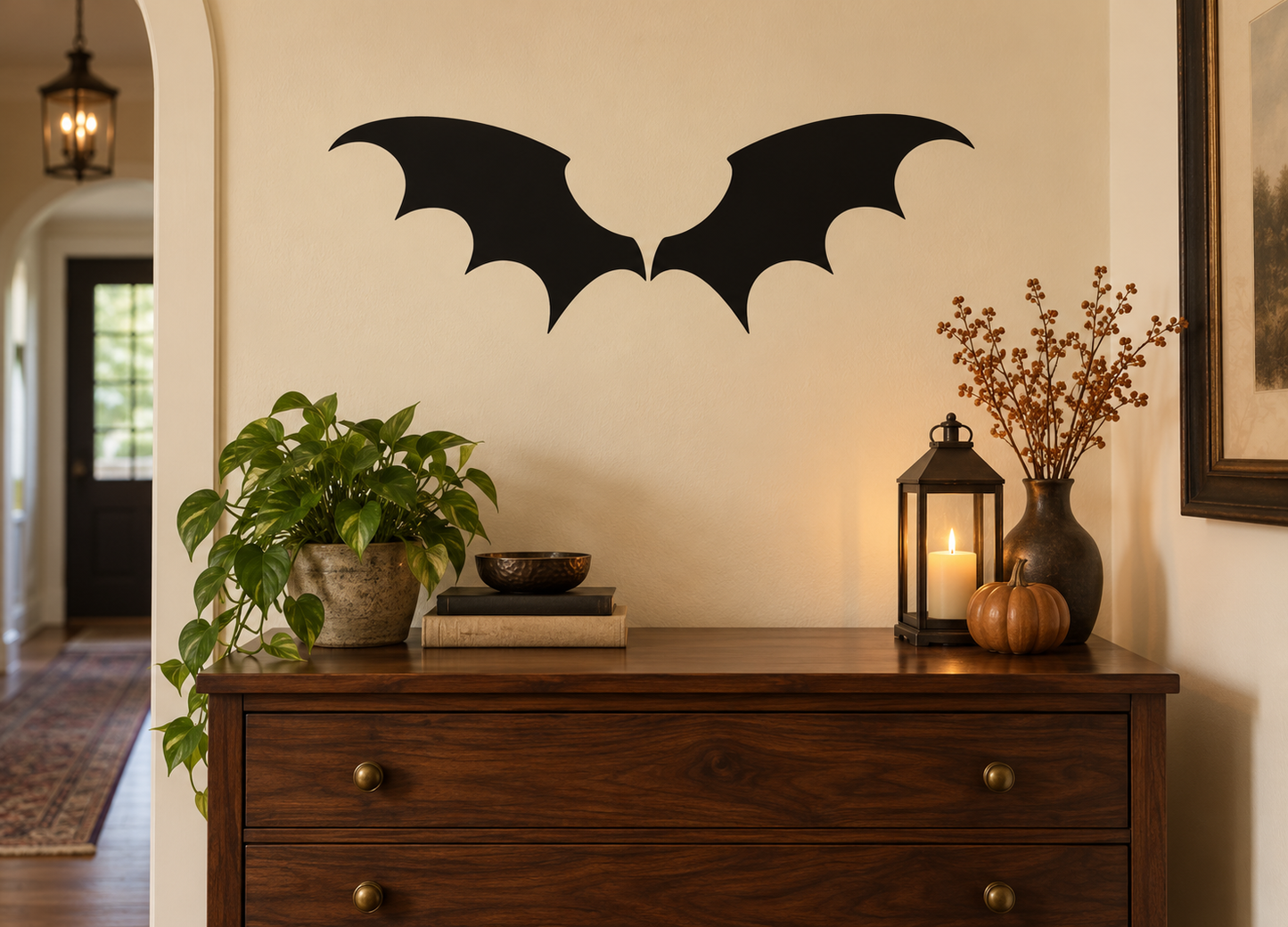Pair of black bat wing vinyl decals on a wall