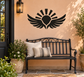 Vinyl wall decal with black wing-and-sunburst icon above a bench