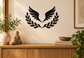 Black vinyl wall decal of open laurel wreath with spread wings, centered