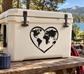 Heart-shaped vinyl decal with black world map on light background