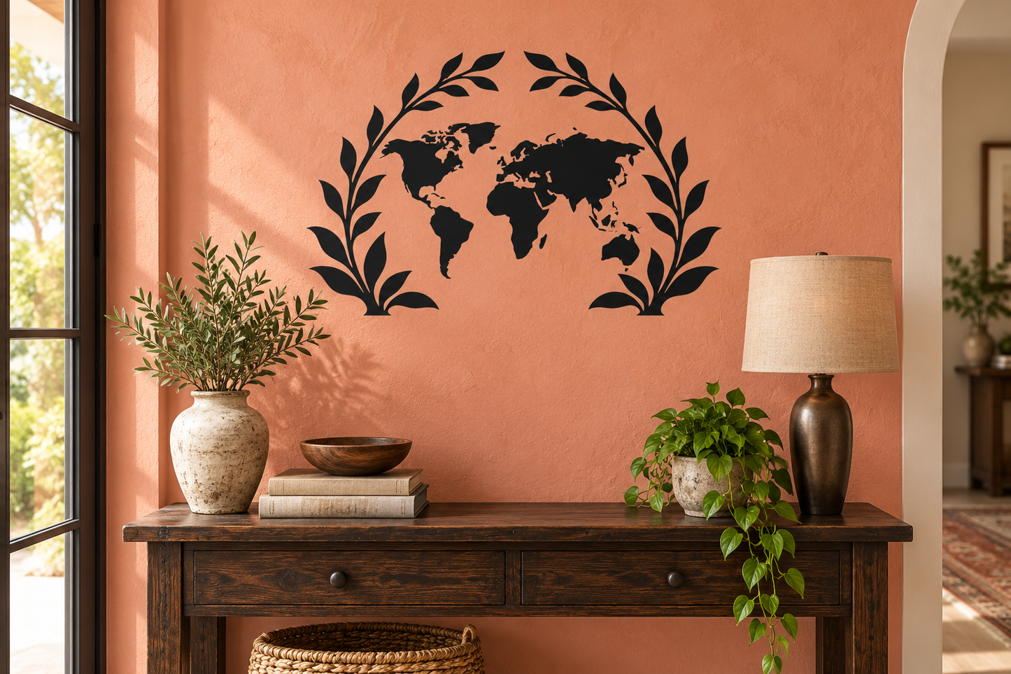 World map vinyl decal with botanical arch leaves, black outline on wall