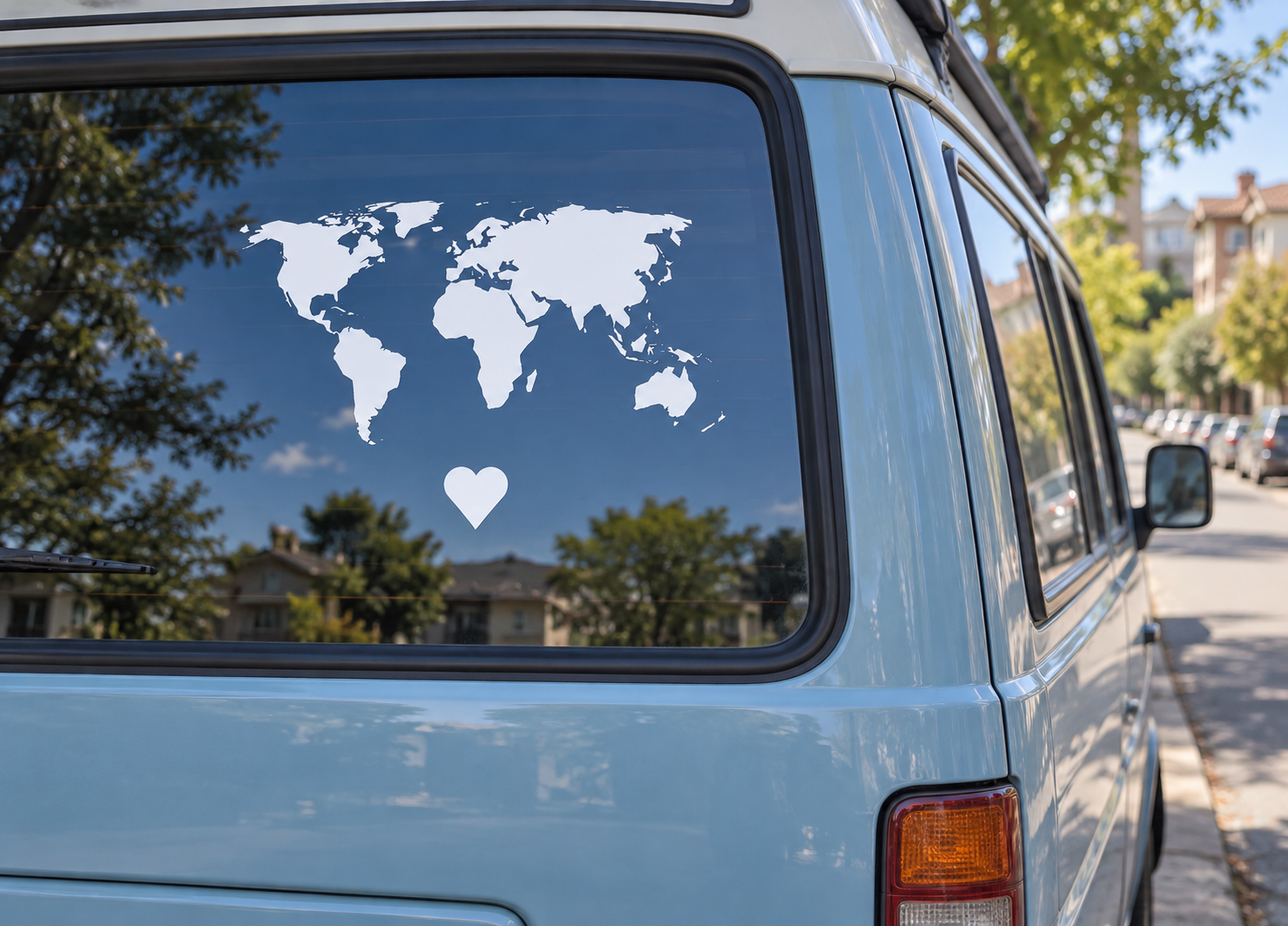 World vinyl world map decal with heart, applied to van window