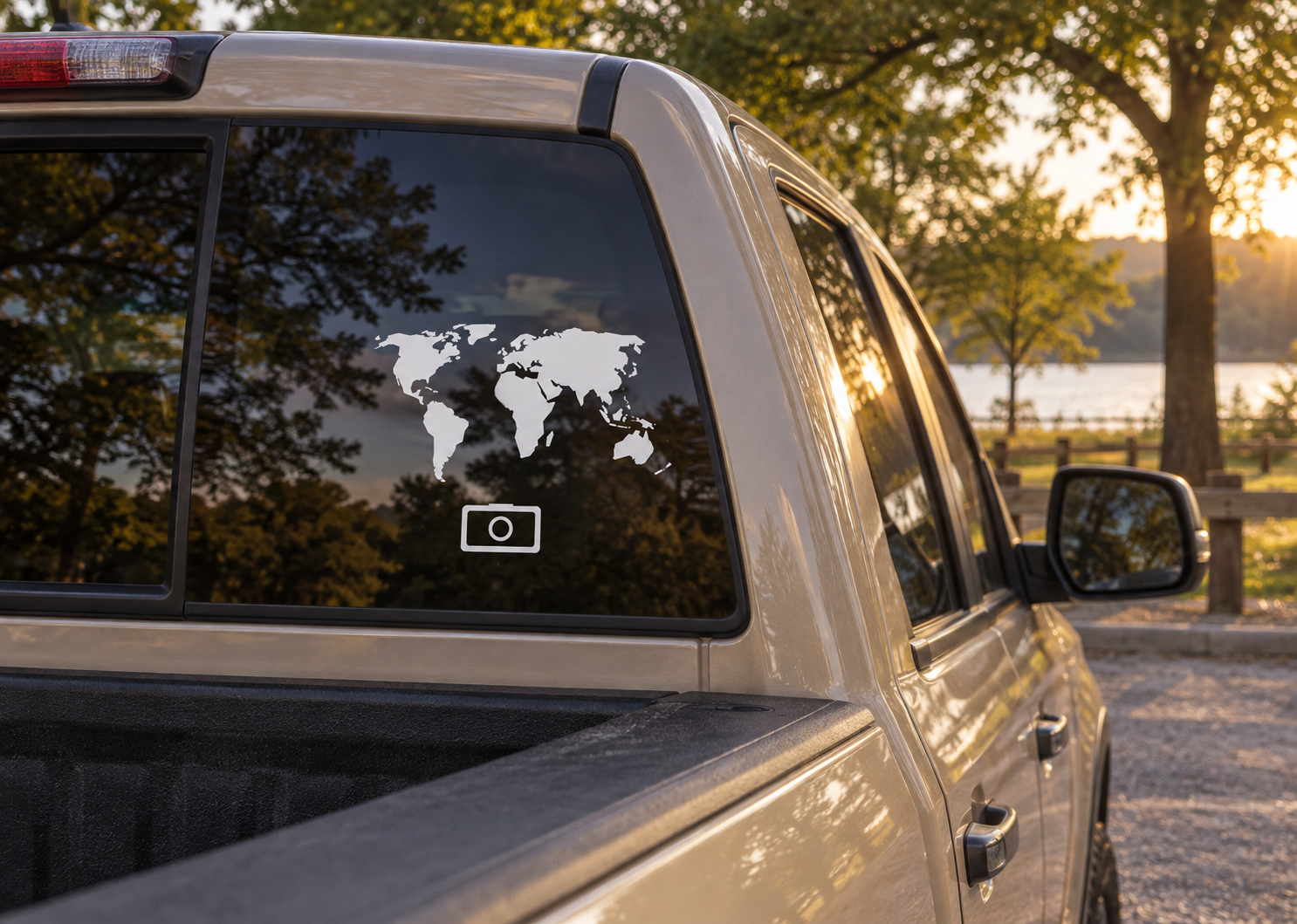 World vinyl decal on car window showing black world map and camera-lens icon