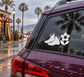 Wrestling shoes and wildflower vinyl decal on vehicle rear window