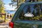 White-outlined black mountain vinyl decal with circular base on car window