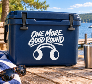 Vinyl decal with “ONE MORE GOOD ROUND” text and cartoon headphones on a blue surface