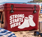 Vinyl wrestling decal with “STRONG STARTS HERE” text and two wrestling shoes, white on red