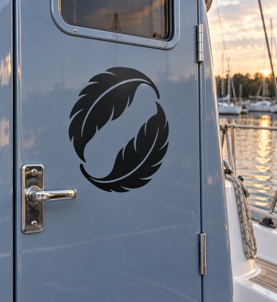 Black and white yin-yang feather vinyl decal on a light blue cabinet door.
