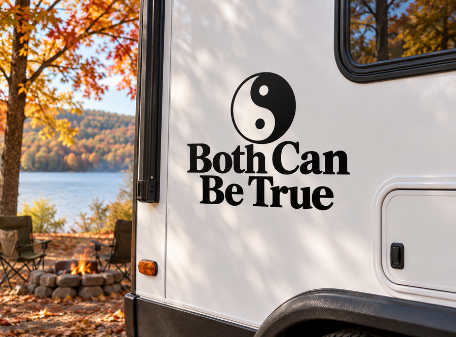 Yin-yang vinyl decal with black and white swirl and small dots, mounted on a surface