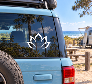 White lotus unfolding vinyl decal for yoga, centered on car window