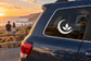 Vinyl moon balance decal with leaf-and-flame yoga symbol on car window