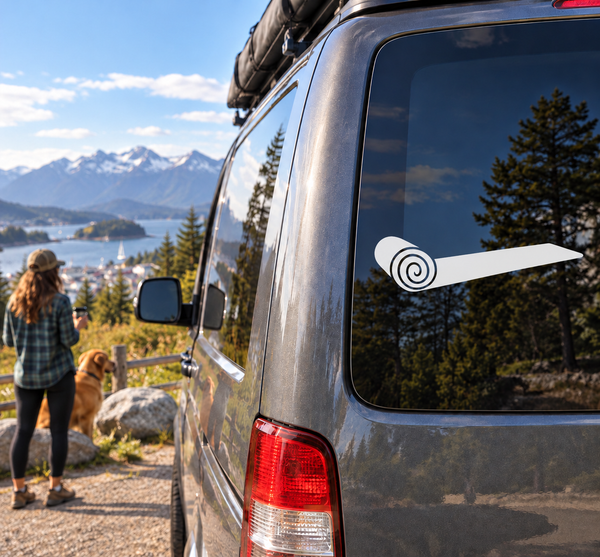 White and black rolled yoga mat vinyl decal with spiral icon on car window