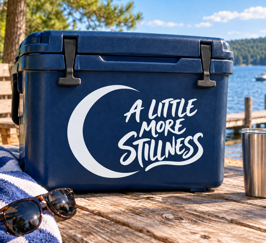 Yoga vinyl decal with a white crescent moon and “A LITTLE MORE STILLNESS” lettering