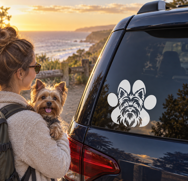 Vinyl decal featuring a Yorkshire terrier face with paw prints on a car window