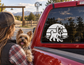 Black and white Yorkshire terrier vinyl decal with stripe backdrop on car window
