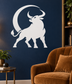 White bull and crescent vinyl zodiac decal on a dark blue wall