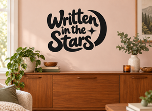 Black vinyl wall decal reading "Written in the Stars" with moon and star