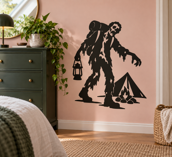 Zombie camper vinyl decal featuring a zombie holding a lantern beside a tent and campfire