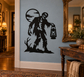 Zombie lantern vinyl decal: zombie holding a hanging lantern, black silhouette