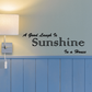 Wall decal: black script text 'A good laugh is sunshine in a house'.