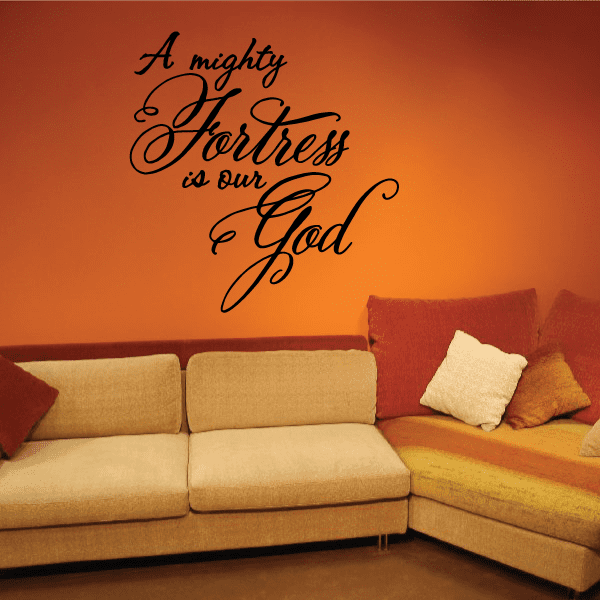 Wall decal with black cursive text: “A mighty Fortress is our God”