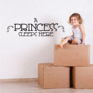 Wall decal: "A PRINCESS SLEEPS HERE" in decorative black lettering.