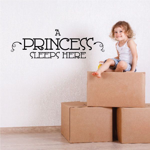 Wall decal: "A PRINCESS SLEEPS HERE" in decorative black lettering.