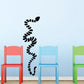 Black abstract snake wall decal with segmented coiled silhouette