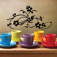 Black floral bird wall decal with curling vines and flowers