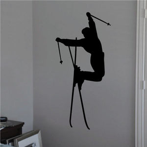 Skier jump decal, black silhouette of aerial skier holding poles and skis