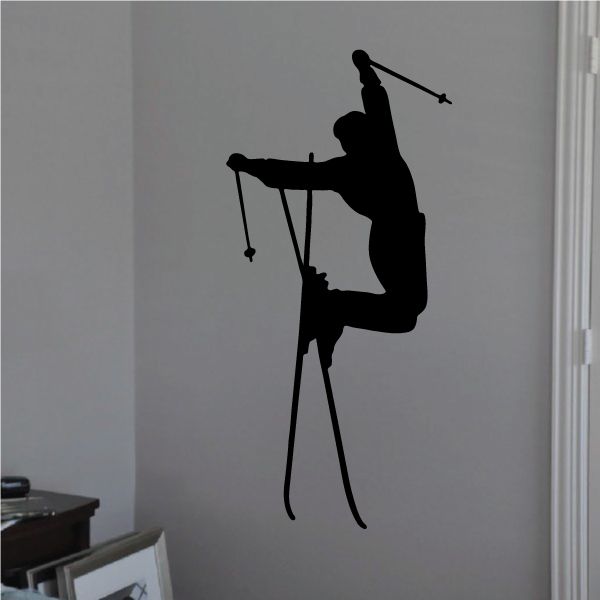 Skier jump decal, black silhouette of aerial skier holding poles and skis