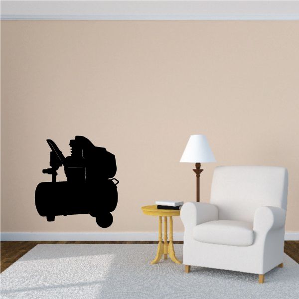 Air compressor wall decal showing black silhouette of wheeled compressor