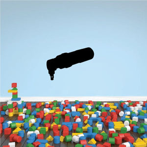 Air nibbler decal with black tool and colorful plastic blocks piled below